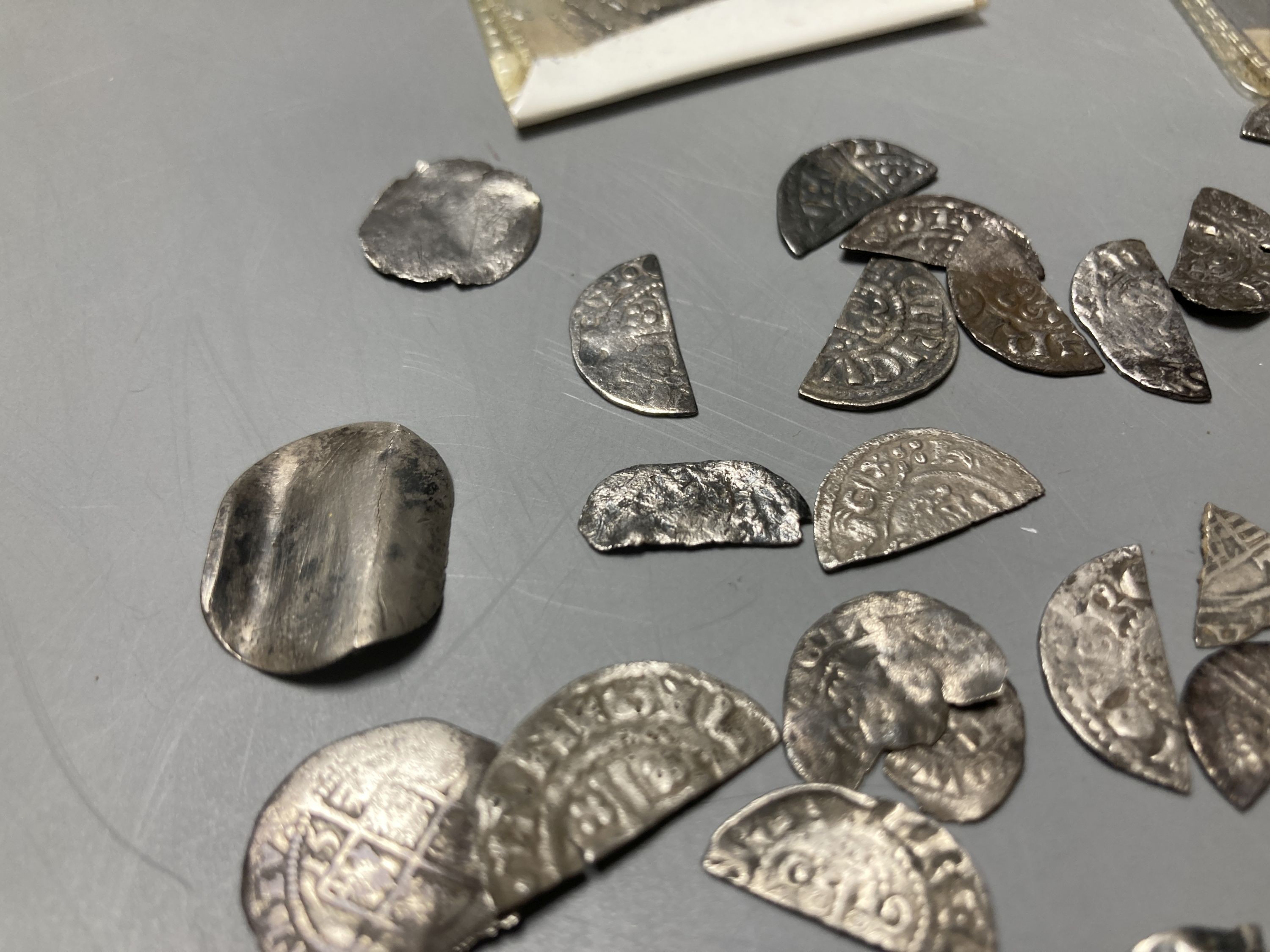 Medieval to Tudor hammered coinage - a collection of cut half and quarter short and long cross pennies and other fragments